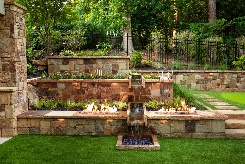 Serene Stone Patio With Water Feature and Fire Pit